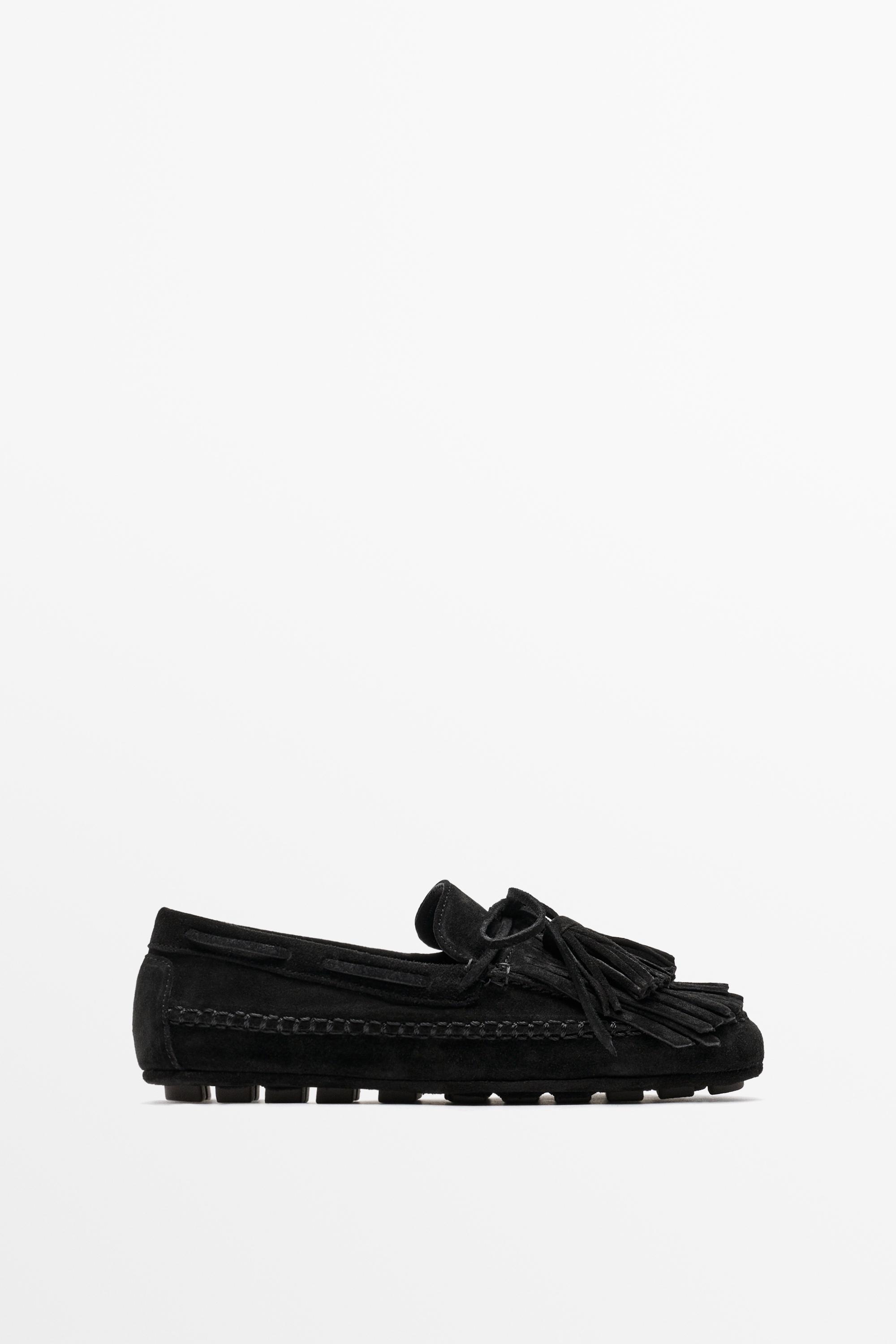 Mocassin en cuir à franges et pompons